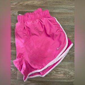 Large Pink Nike shorts.